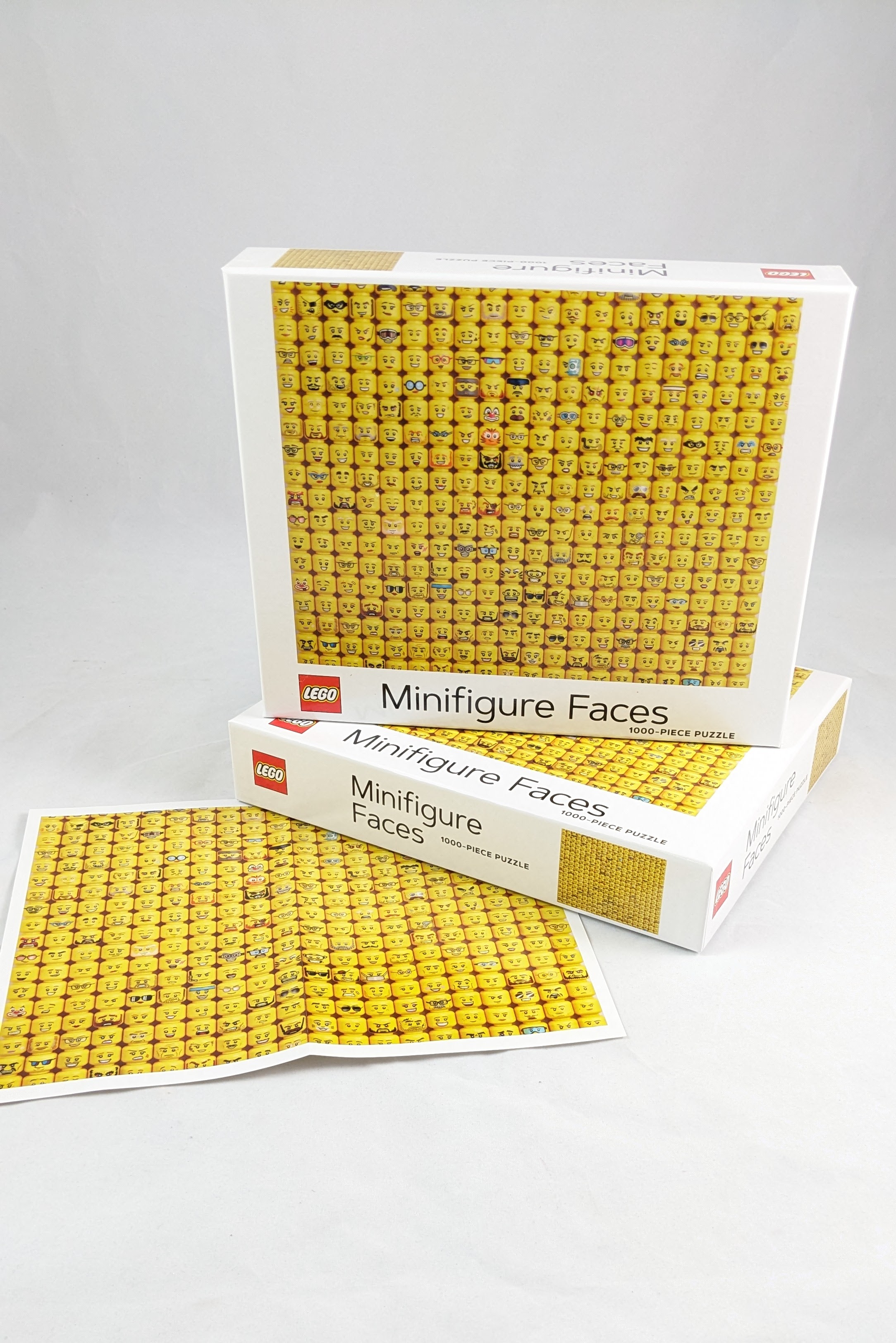 Lego Mini faces puzzle, displayed with the poster included in box.