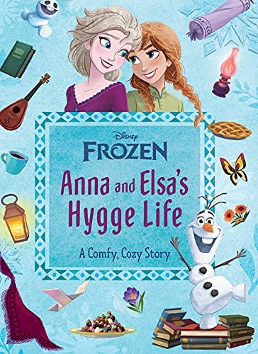 Book cover with center title and above graphic of two women smiling at each other with a variety of cozy items arranged around the title.