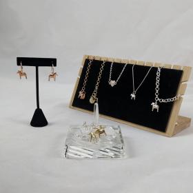 A collection of the dala horse bracelets and earrings from Anna Victoria. 