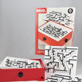 Labyrinth game unboxed, shows the box, table turner game with knobs and two alternate maze plates. 