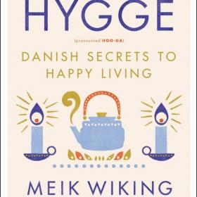 Book cover with title and graphics of a tea kettle and candles.